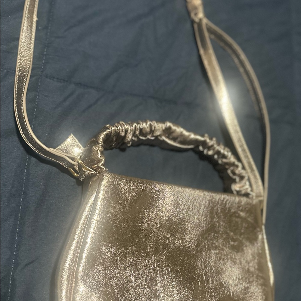 Purple Crossbody Bag with Metallic Finish and Elegant Design